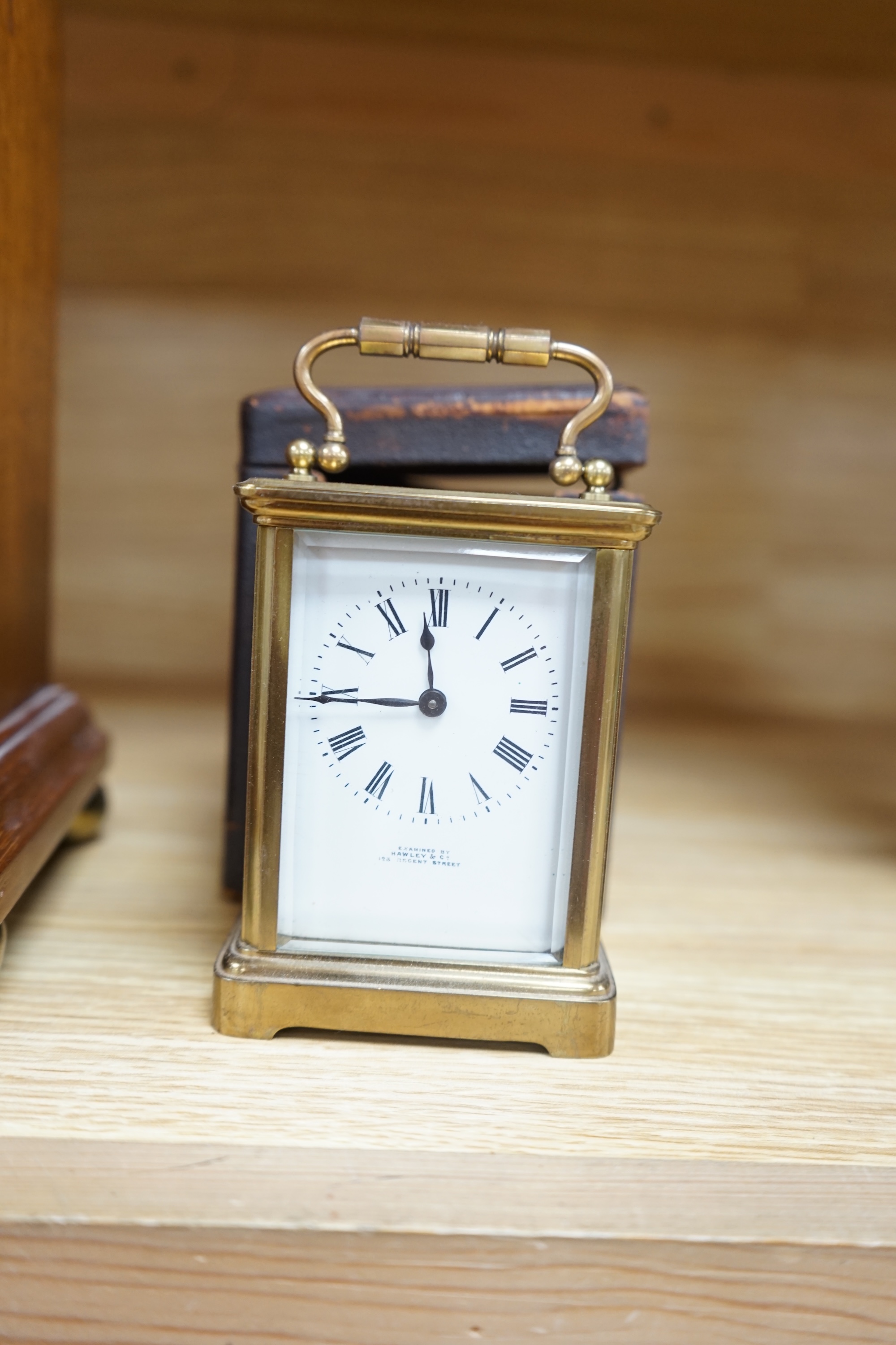 A cased brass carriage timepiece and a dome topped Edwardian mantel clock striking on a coiled gong, backplate stamped BTG, 29.5cm (2) Condition - fair to good.